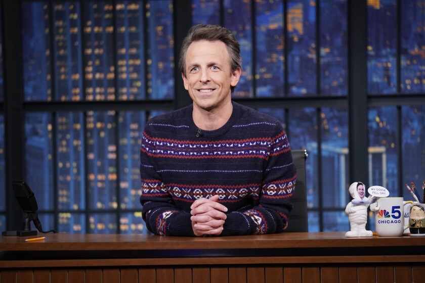 This image released by NBC shows Seth Meyers on "Late Night with Seth Meyers" in New York on Dec. 16, 2021. This week’s remaining episodes have been scrapped after the Meyers tested positive for COVID-19. Meyers tweeted Tuesday his positive result but said he felt fine, thanking the vaccine and a booster. NBC has canceled shows scheduled from Tuesday to Friday. (Lloyd Bishop/NBC via AP)