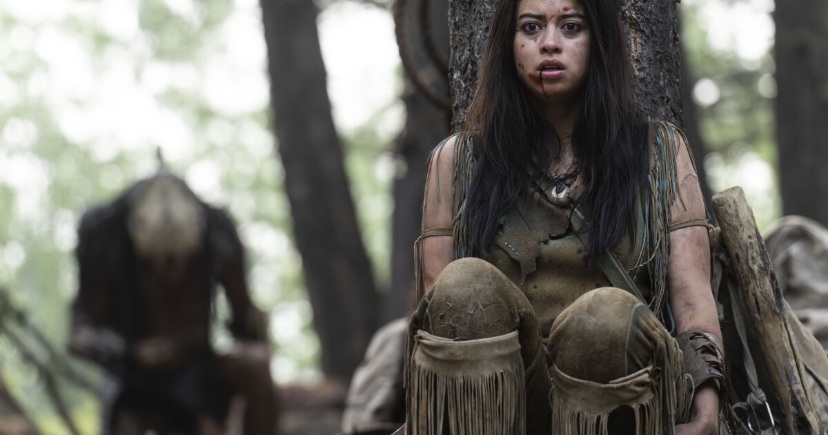 Naru (Amber Midthunder) pursued by the predator in Prey.