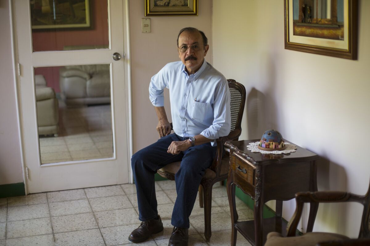 FILE - Retired Sandinista Gen. Hugo Torres poses for portrait at his home, in Managua, Nicaragua, May 2, 2018. The former Sandinista guerrilla leader and opposition politician died in prison at the age of 73, relatives said Saturday, Feb. 12, 2022. Torres was the first of a large group of opposition leaders rounded up in a 2021 crackdown to die; it was unclear if his death was hastened by conditions in prison. (AP Photo/Moises Castillo, File)