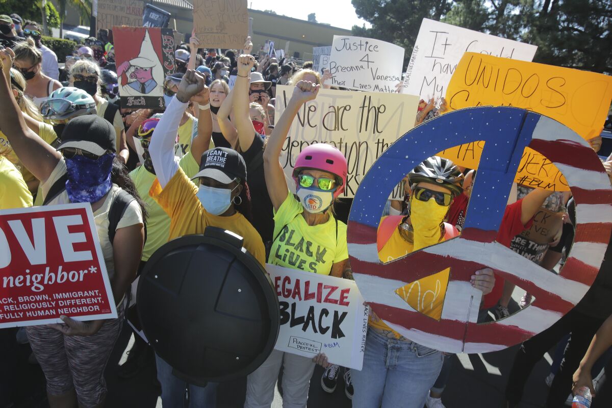 Protesters rally for a Black Lives Matter in La Mesa on Saturday, Aug. 1.