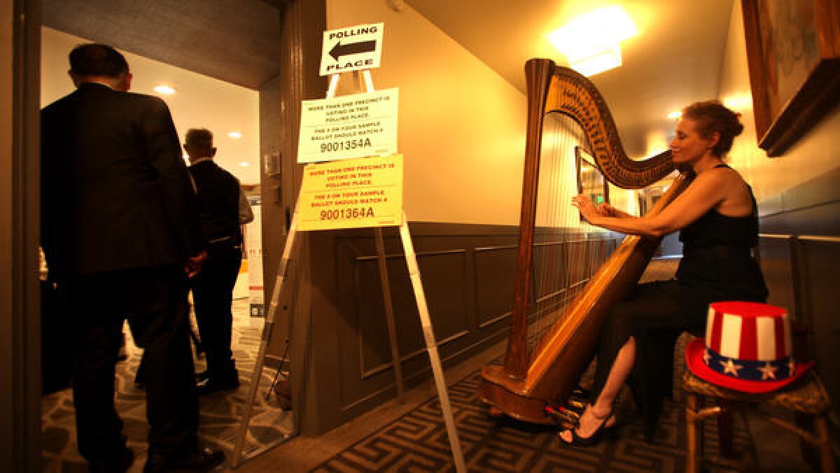 A harpist plays for voters inside the Luxe Sunset Boulevard Hotel in 2014.
