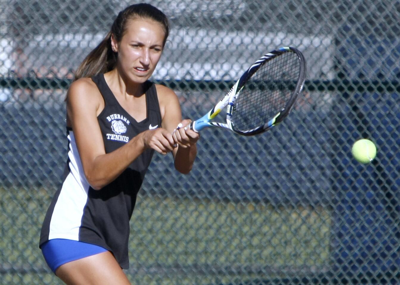 Burbank High School tennis player Kristina Kirakosyan returns the ball in game vs. Crescenta Valley High School at home in Burbank on Thursday, October 20, 2016.