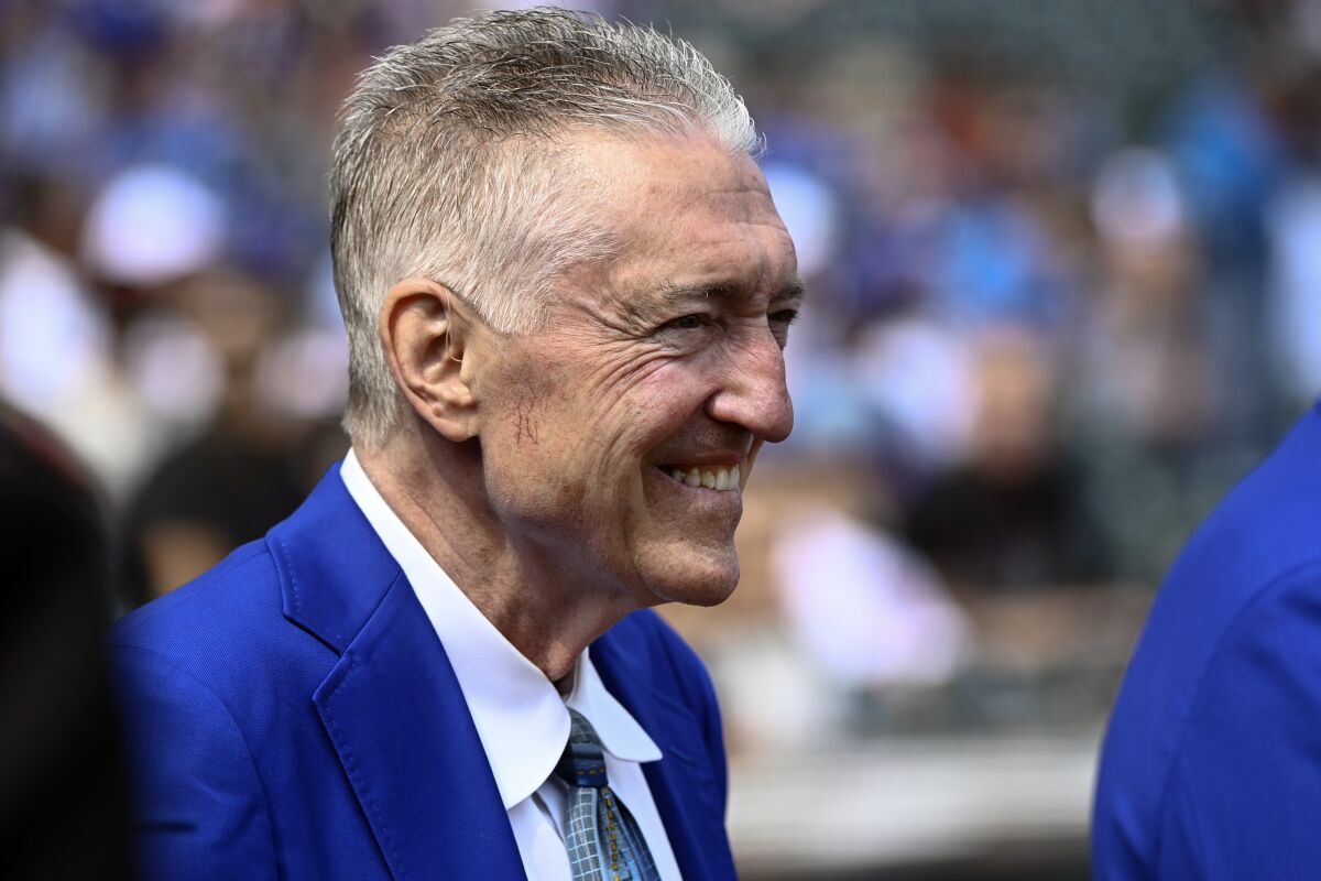 FILE - Chicago Cubs' Hall of Famer Pat Hughes smiles during a pregame ceremony before a baseball game against the San Francisco Giants in Chicago, on Sept.10, 2022. Hughes, the longtime radio voice of the Chicago Cubs, won Hall of Fame’s 2023 Ford C. Frick Award for excellence in baseball broadcasting on Wednesday, Dec. 7, 2022. (AP Photo/Matt Marton, File)