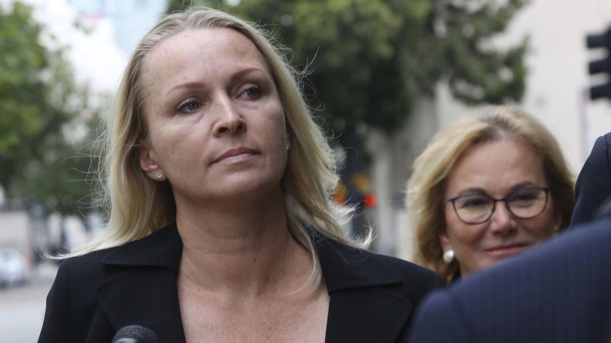 Margaret Hunter, left, arrives at the federal courthouse in downtown San Diego last week to plead guilty to conspiring to illegally spend campaign funds on personal expenses.