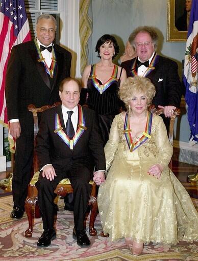 Kennedy Center honorees musician Paul Simon, actress Elizabeth Taylor, actor James Earl Jones, actress Chita Rivera and conductor James Levine sit for a class portrait in December 2002 after the Kennedy Center Honors Gala at the US State Department in Washington, D.C.