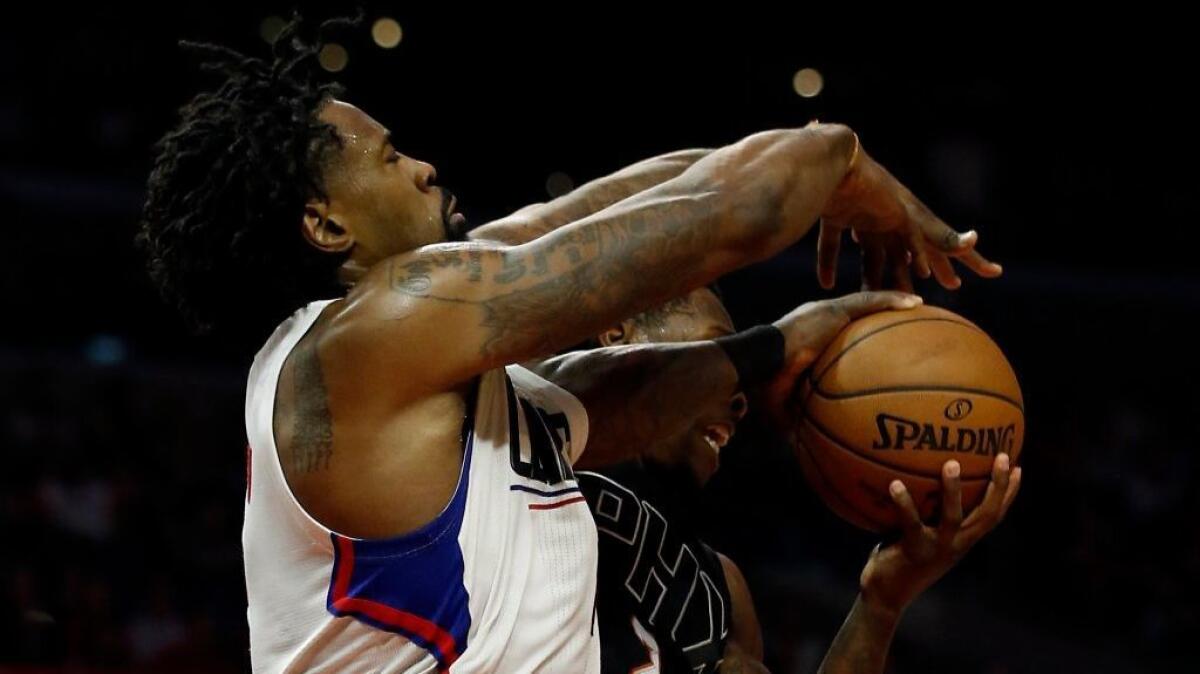 Clippers big man DeAndre Jordan covers Suns guard Eric Bledsoe during a game at Staples Center on Jan. 2