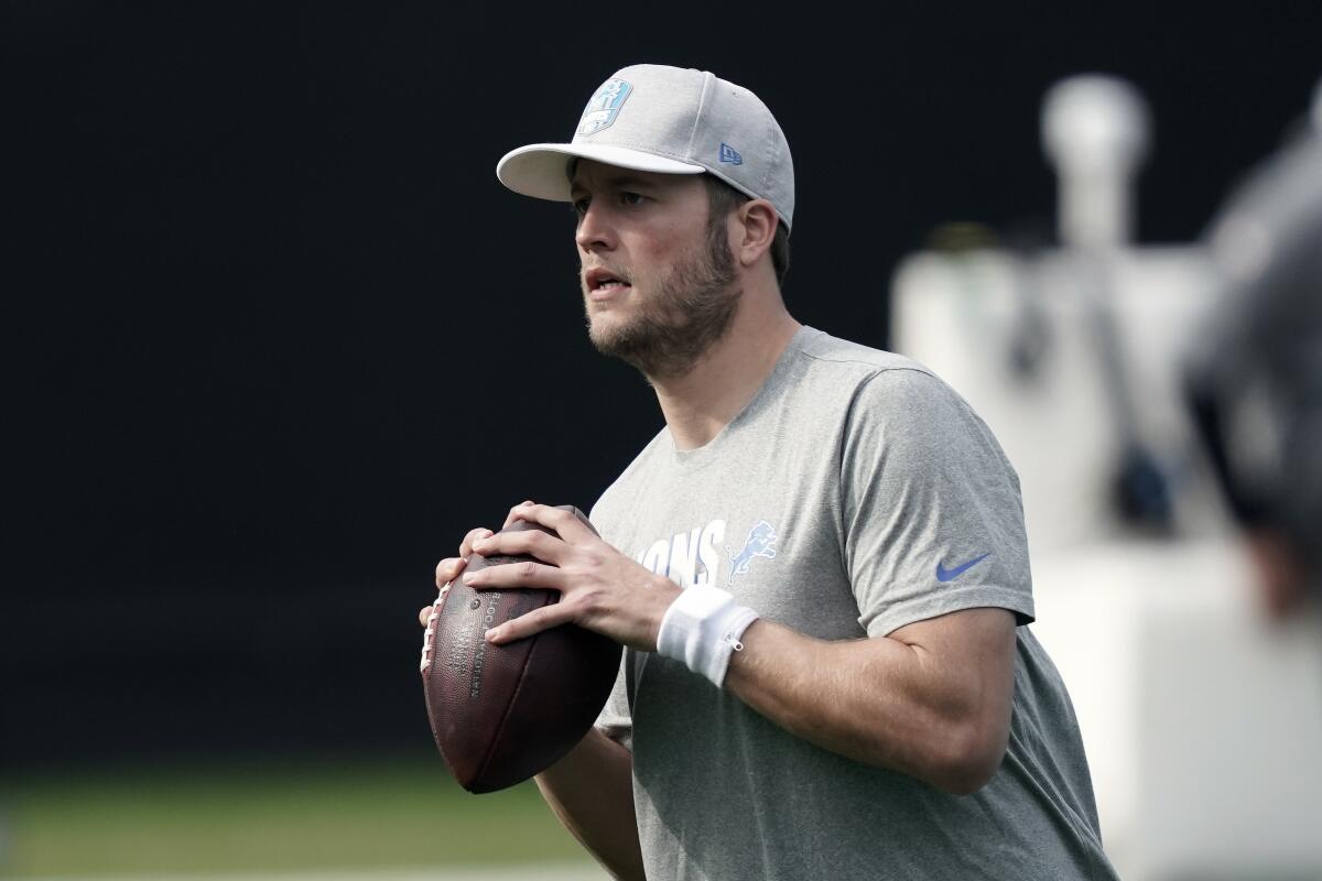 Matthew Stafford warms up prior to a game against the Carolina Panthers.