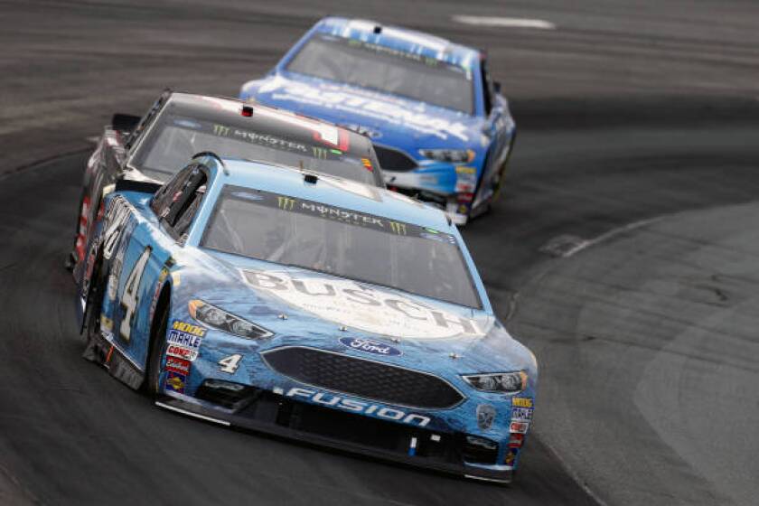 LOUDON, NH - JULY 22: Kevin Harvick, driver of the #4 Busch Beer Ford, leads Clint Bowyer, driver of the #14 Haas 30 Years of the VF1 Ford, and Ricky Stenhouse Jr., driver of the #17 Fastenal Ford, during the Monster Energy NASCAR Cup Series Foxwoods Resort Casino 301 at New Hampshire Motor Speedway on July 22, 2018 in Loudon, New Hampshire. (Photo by Jeff Zelevansky/Getty Images)