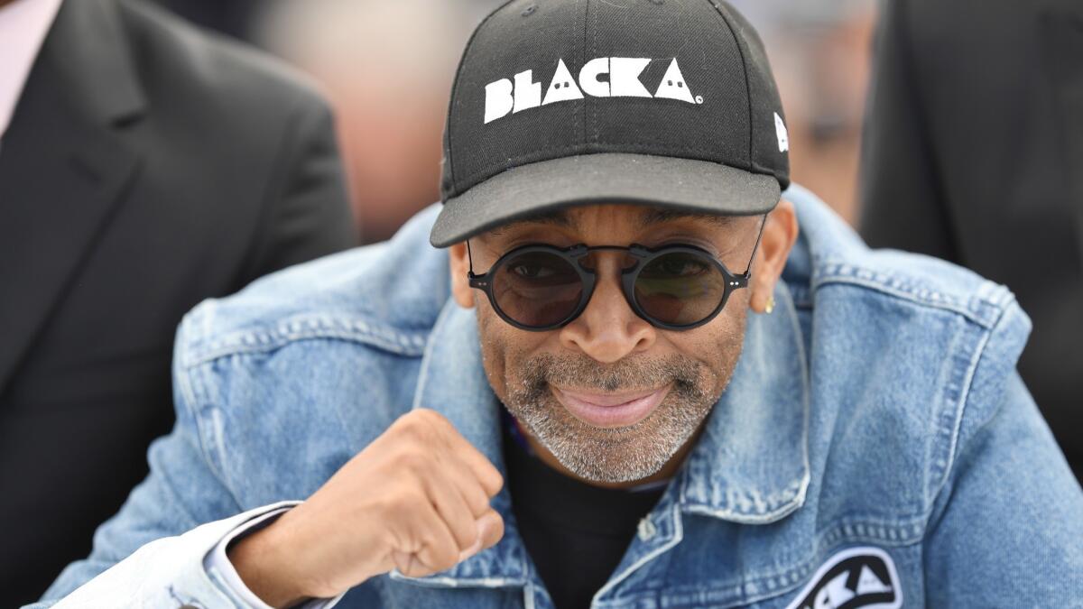 Director Spike Lee makes a fist as he attends the photo call for "BlacKkKlansman" during the 71st Cannes Film Festival at Palais des Festivals.