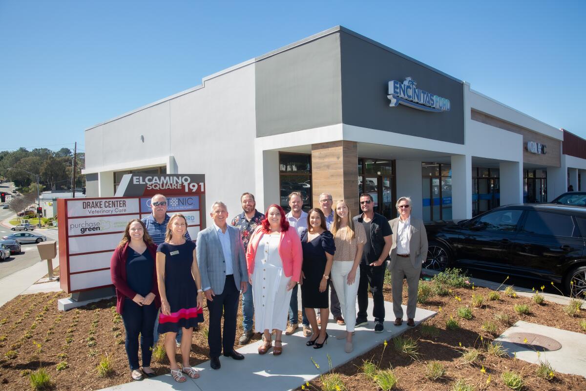 The teams from White Construction and Capstone Advisors at the ribbon cutting for El Camino Square.