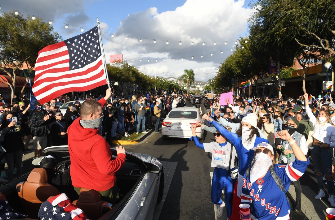 People celebrate along Santa Monica Blvd. in West Hollywood.