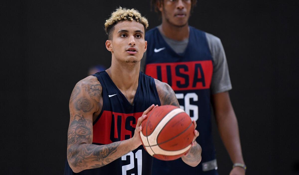 Team USA's Kyle Kuzma (21) shoots jumpers in front of Myles Turner (56) during World Cup training camp at UCLA Health Training Center on Tuesday in El Segundo.