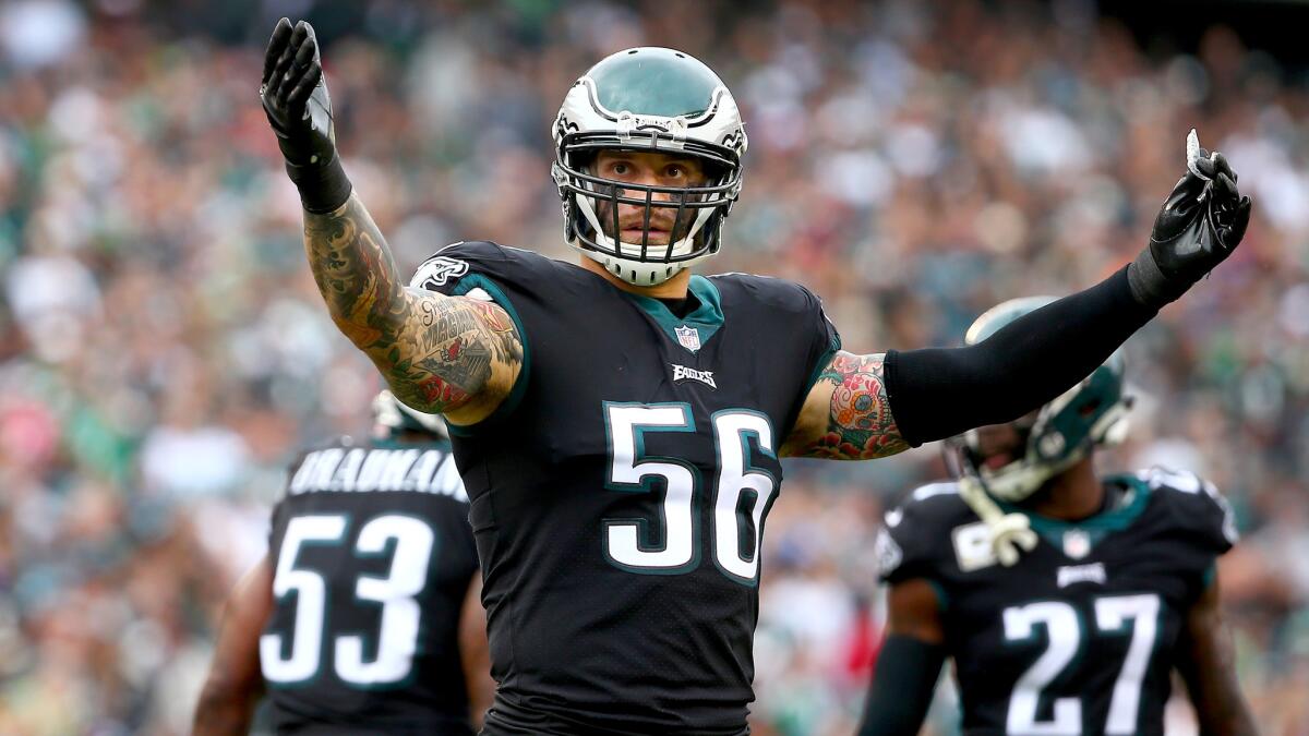 Eagles defensive end Chris Long encourages the crowd to make some noise during a game against the Denver Broncos earlier this season.