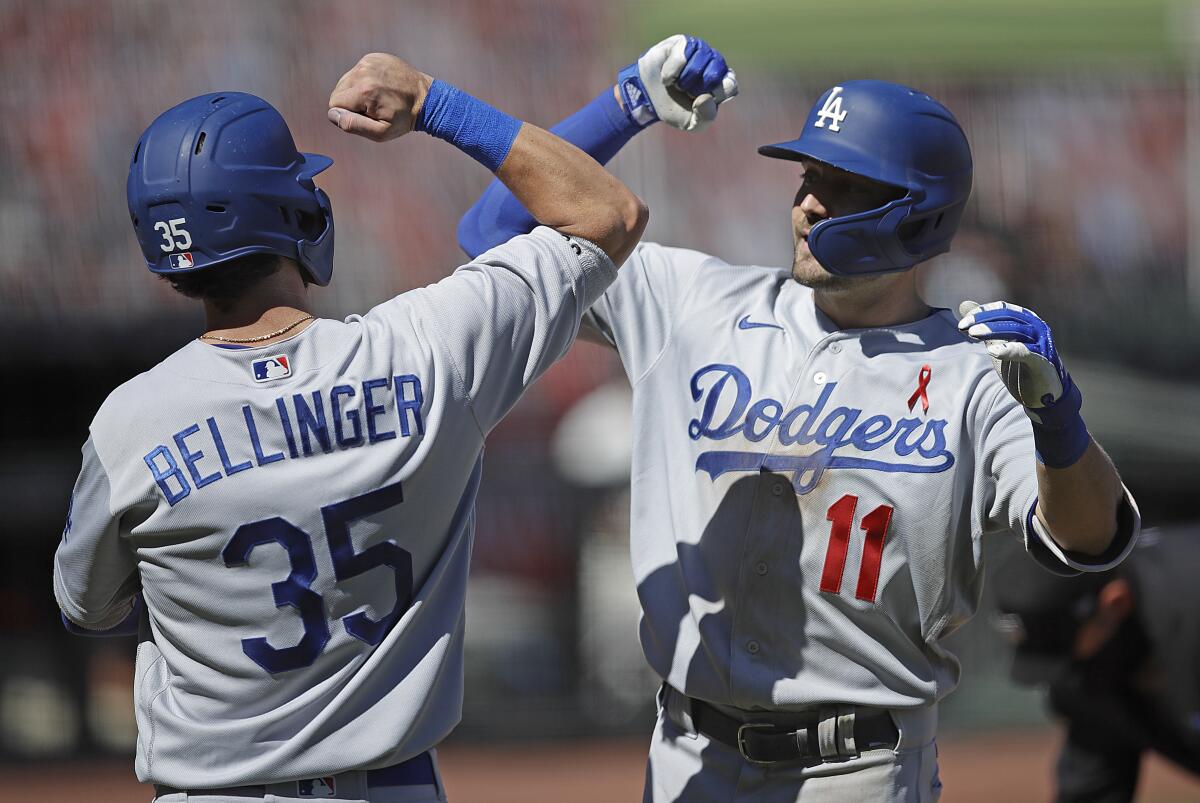 A.J. Pollock, right, celebrates with teammate Cody Bellinger after hitting a two-run home run.