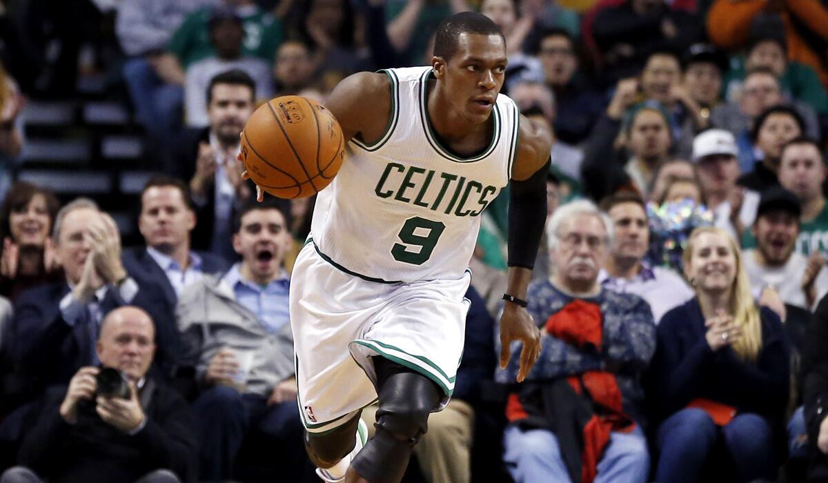 Celtics point guard Rajon Rondo dribbles up the court during a Dec. 3 game against the Detroit Pistons in Boston.