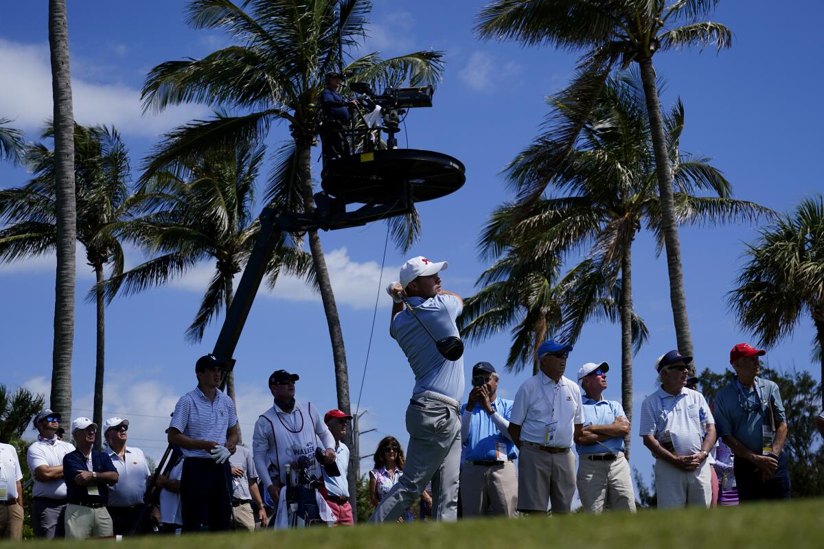Alex Fitzpatrick, of the Great Britain and Ireland team, watches his tee shot on the 15th hole in the foursome matches during the Walker Cup golf tournament at the Seminole Golf Club on Saturday, May 8, 2021, in Juno Beach, Fla. (AP Photo/Brynn Anderson)