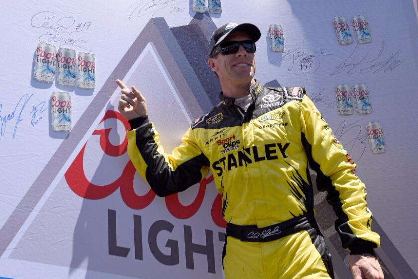 NASCAR driver Carl Edwards celebrates after winning the pole during qualifying for the Save Mart 350 at Sonoma Raceway on June 25.