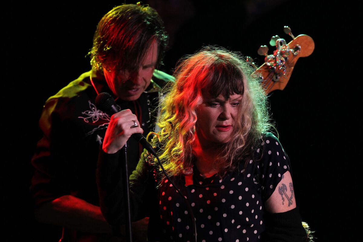 Long-running L.A. punk-rock band X, with members John Doe and Exene Cervenka shown during a 2014 performance in West Hollywood, are back at the Roxy this week for shows marking the quartet's 40th anniversary.