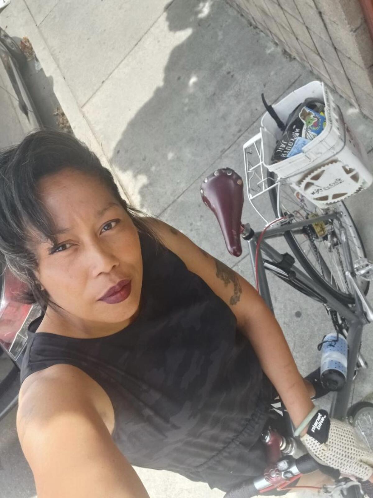 Pauletta Pierce with her bike in Chinatown. 