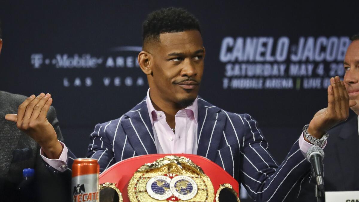 IBF middleweight world champion Daniel Jacobs reacts to fans during a February news conference in New York to promote his fight with WBC and WBA champion Canelo Alvarez.