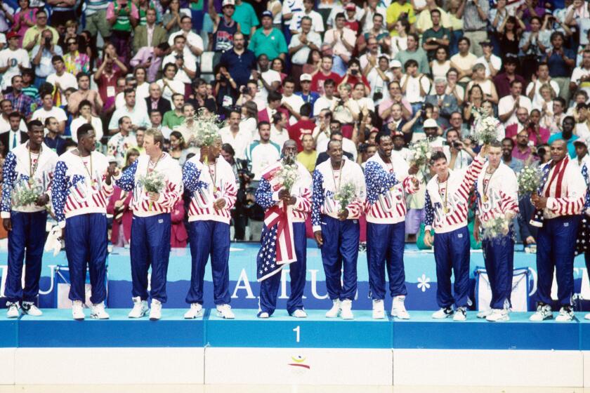 Basketball: 1992 Summer Olympics: USA (left to right) Christian Laettner, David Robinson, Patrick Ewing, Larry Bird, Scottie Pippen, Michael Jordan, Clyde Drexler, Karl Malone, John Stockton, Chris Mullin, and Charles Barkley victorious on podium after winning Men's Gold Medal Game vs Croatia at Pavello Olimpic. Dream Team. Badalona, Spain 8/8/1992 CREDIT: Richard Mackson (Photo by Richard Mackson /Sports Illustrated via Getty Images) (Set Number: X43178 TK47 R1 F22 )