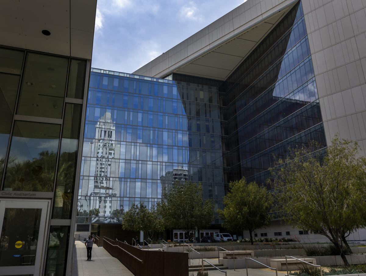 Los Angeles City Hall is reflected in the windows of the Los Angeles Police Headquarters on April 20. 