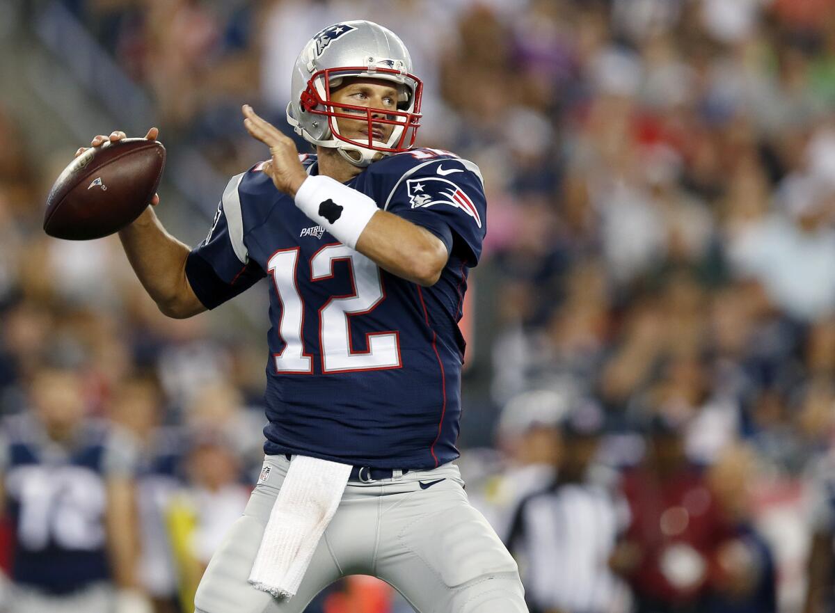 Patriots quarterback Tom Brady passes against the Packers in the first half of an NFL preseason game.
