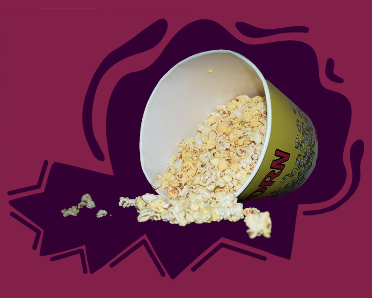 Container of move theater popcorn spilled over.