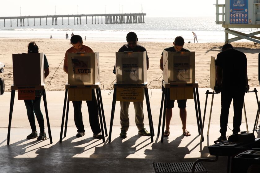 VENICE CA NOVEMBER 6, 2018 -- Voters casts their ballots at the Venice Beach Lifeguard Operations polling location near the Venice Pier Tuesday morning, November 6, 2018. (Al Seib / Los Angeles Times)