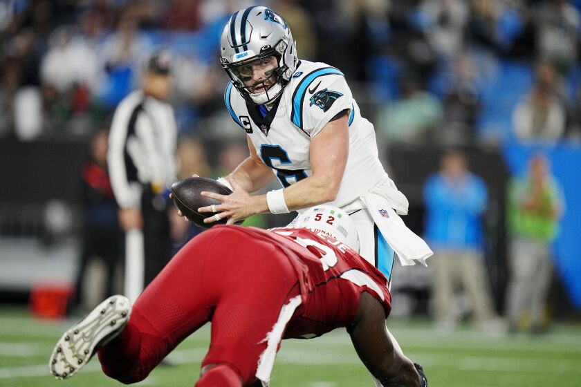 Arizona Cardinals linebacker Victor Dimukeje puts pressure on Carolina Panthers quarterback Baker Mayfield during the second half of an NFL football game on Sunday, Oct. 2, 2022, in Charlotte, N.C. (AP Photo/Rusty Jones)