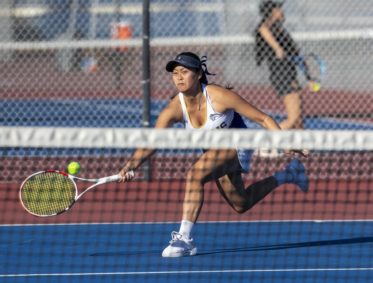 Fountain Valley's Katelyn Nguyen returns a forehand against Palm Desert in a girls' tennis semifinal match on Thursday.