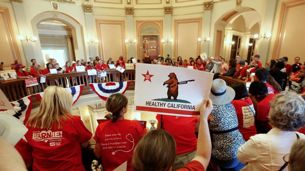 Single-payer supporters demonstrate on the second floor rotunda at the Capitol in Sacramento, Calif. on June 28.