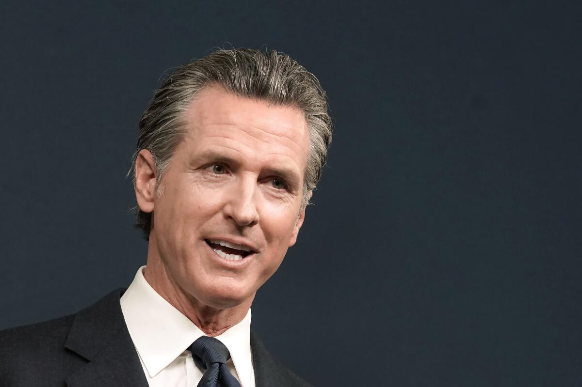  Gov. Gavin Newsom speaks at a news conference