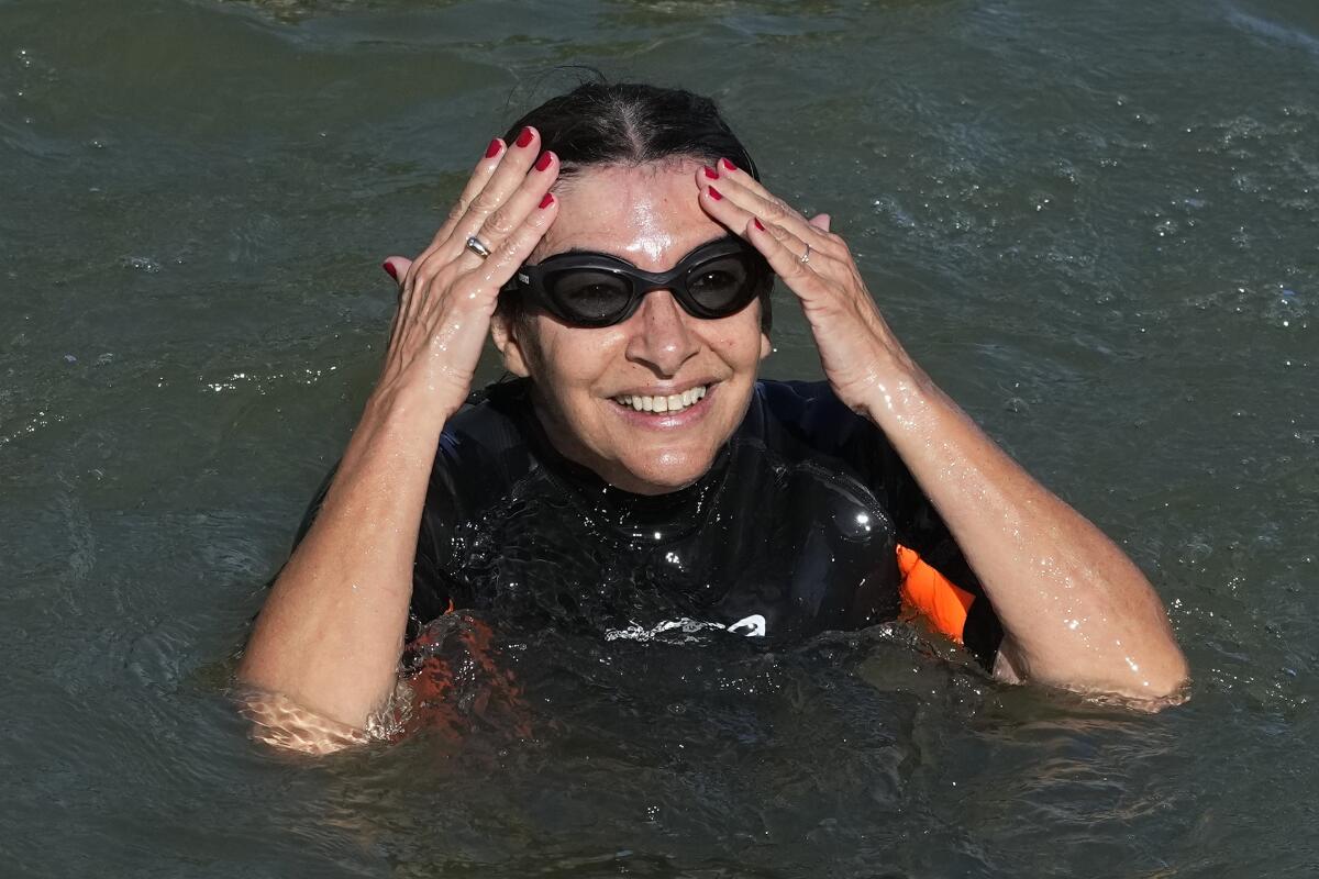 Paris Mayor Anne Hidalgo swims in the Seine River.