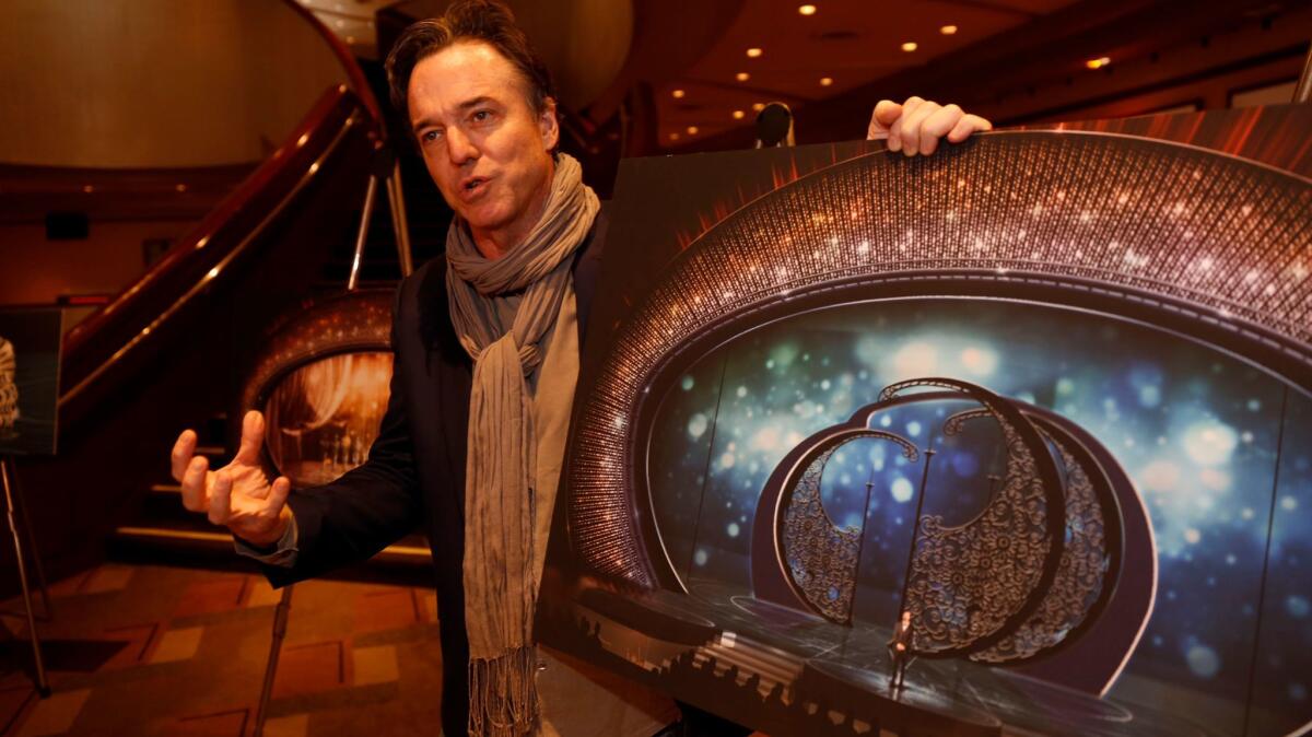 Derek McLane, production designer of the 89th Academy Awards, holds a stage-design rendering for Sunday's Academy Awards at the Dolby Theatre.