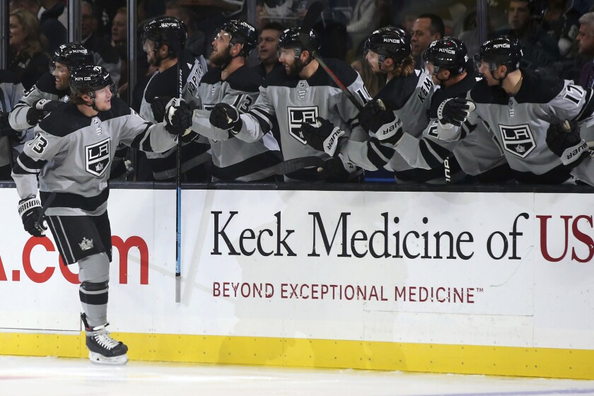 Kings forward Tyler Toffoli celebrates with teammates after scoring against the Calgary Flames on Saturday.