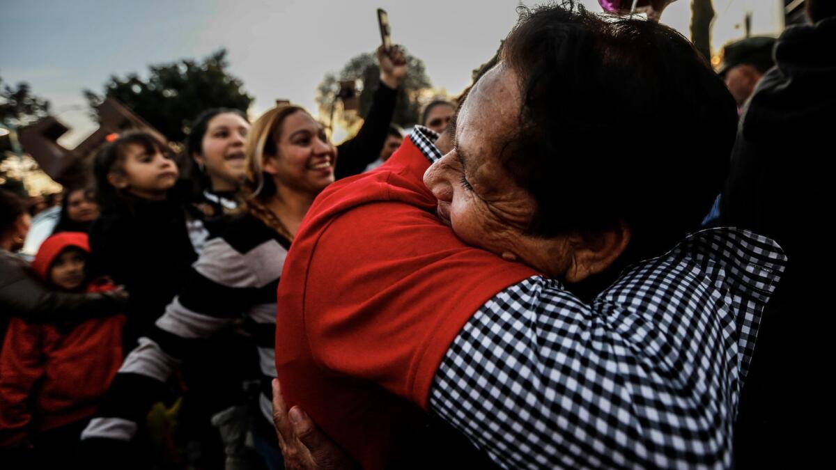 Tirza Valenzuela Esquivel, right, hugs her son, Everardo Valenzuela, whom she has not seen in over 20 years.