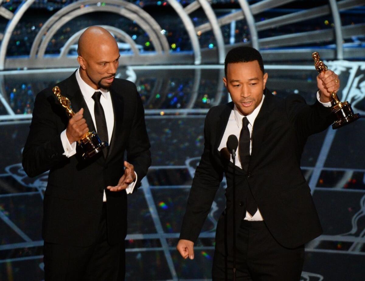 John Legend, right, with Common, left, accept the Oscar for best original song, "Glory," from the "Selma" movie soundtrack.