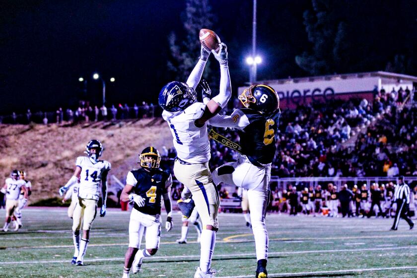 Arlis Boardingham of Birmingham completes magnificent catch in end zone for touchdown against San Pedro.