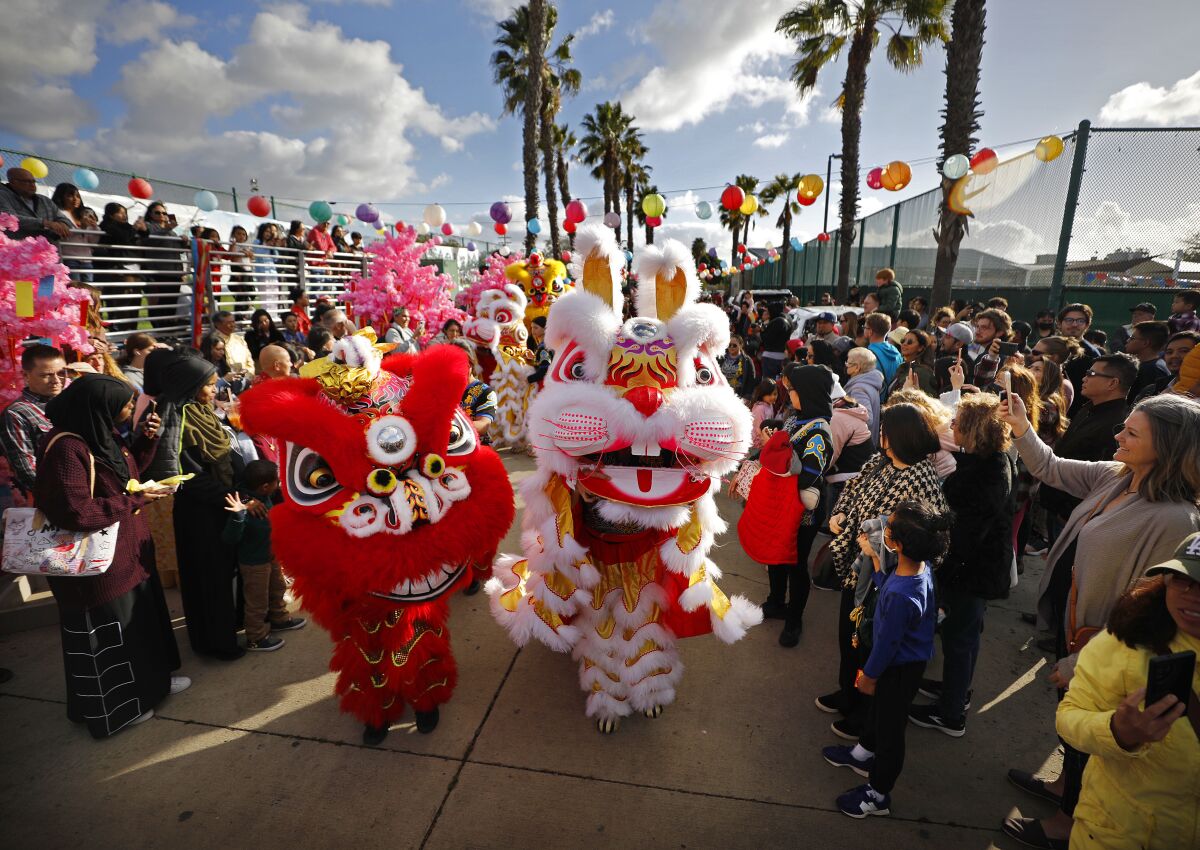 Performers entertain the crowd at the Lunar New Year Festival in City Heights on Sunday.