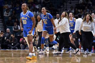 UCLA guard Charisma Osborne reacts after hitting a 3-point basket against USC during the Pac-12 tournament 