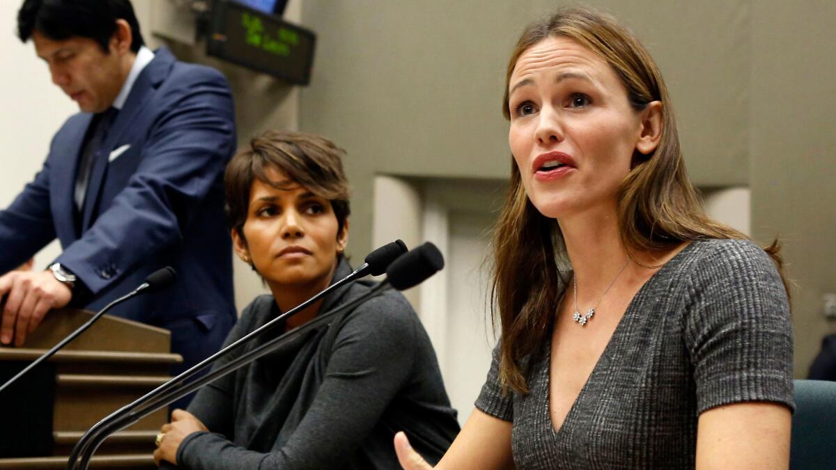 Actresses Jennifer Garner and Halle Berry testify in support of a bill to limit the paparazzi's ability to photograph children of public figures in Sacramento, Calif on Aug. 13, 2013.