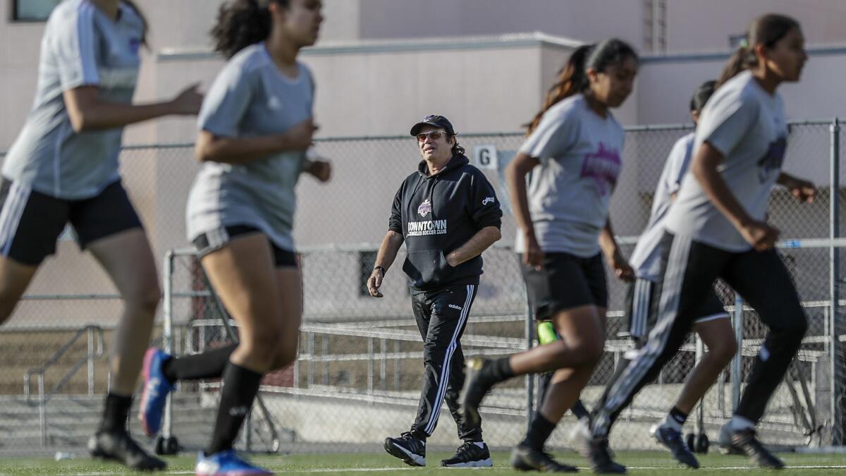 Downtown Los Angeles Soccer Club coach Mick Muhlfriedel supervises a practice at Liechty Middle School.