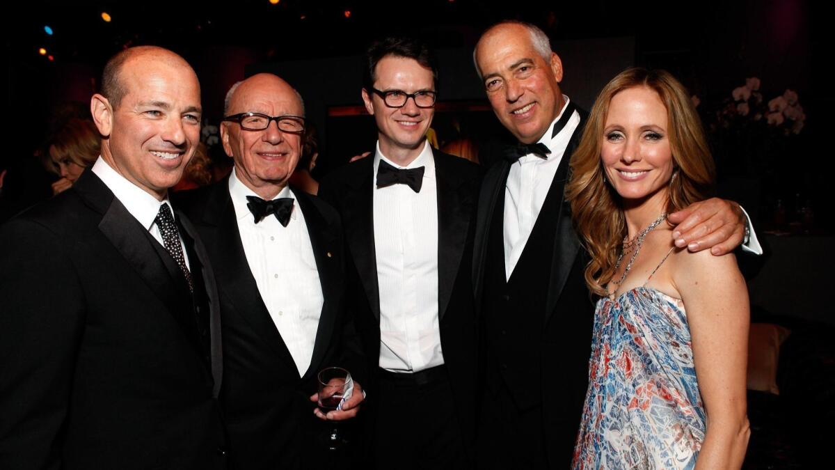 Rupert Murdoch, second from left, is shown in 2012 with writer Howard Gordon, left, and Fox TV executives Peter Rice, Gary Newman and Dana Walden.
