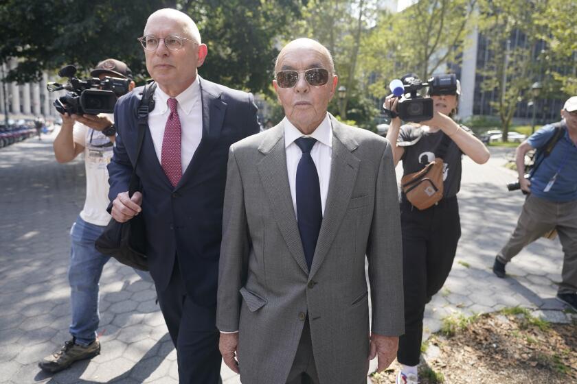 FILE - British billionaire Joe Lewis leaves, center, Manhattan federal court, Wednesday, July 26, 2023, in New York. Lewis, whose family trust owns the Tottenham Hotspur soccer club, is set to be sentenced Thursday, April 4, 2024, after pleading guilty to insider trading and conspiracy charges in New York. Prosecutors say in court documents that his age, medical issues and willingness to come to America to face criminal charges have earned him leniency.. (AP Photo/Mary Altaffer, File)