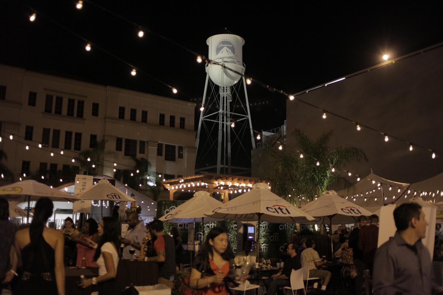 The Paramount water tower overlooks the outdoor lounge area, where guests sample food dishes and drinks.