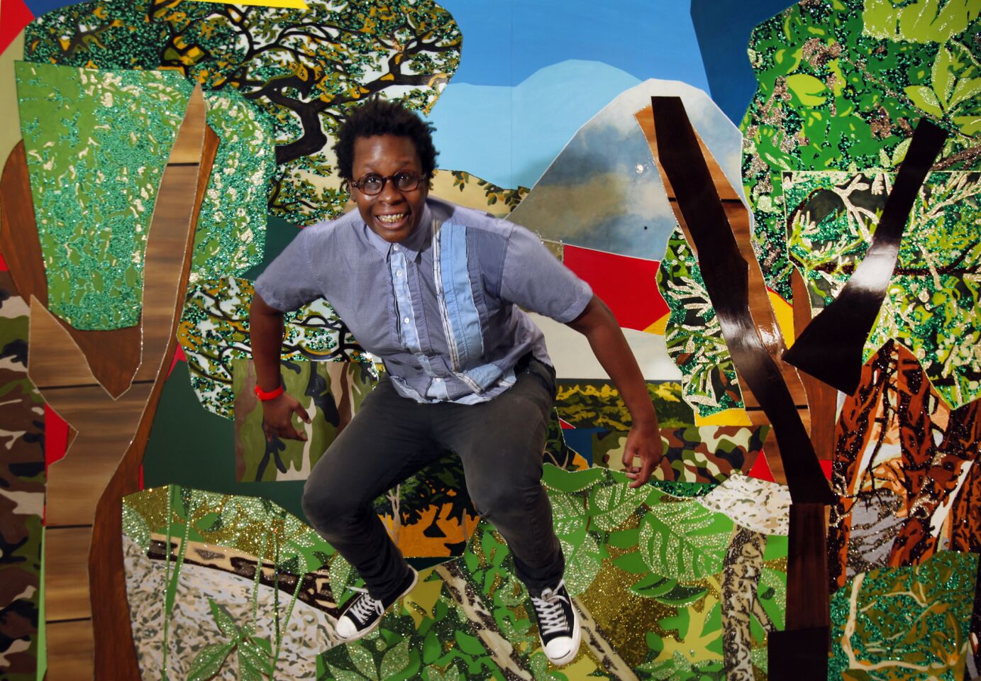 New York-based artist Mickalene Thomas -- best known for her elaborate paintings adorned with rhinestones, enamel and colorful acrylics -- works to finish the installation of her latest show at the Santa Monica Museum of Art in Bergamot Station on April 4, 2012. MORE: Mickalene Thomas, up close and very personal