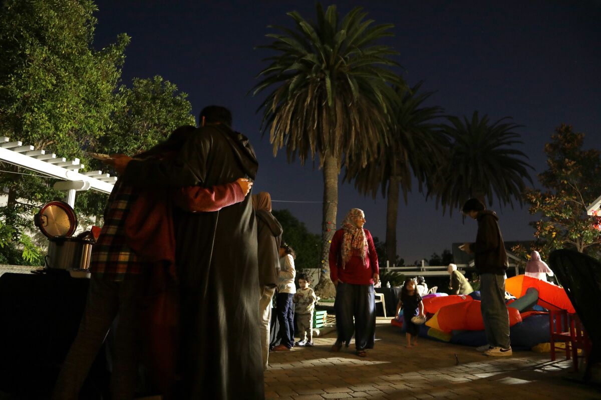 Families gather in a Southern California yard to break their Ramadan fast