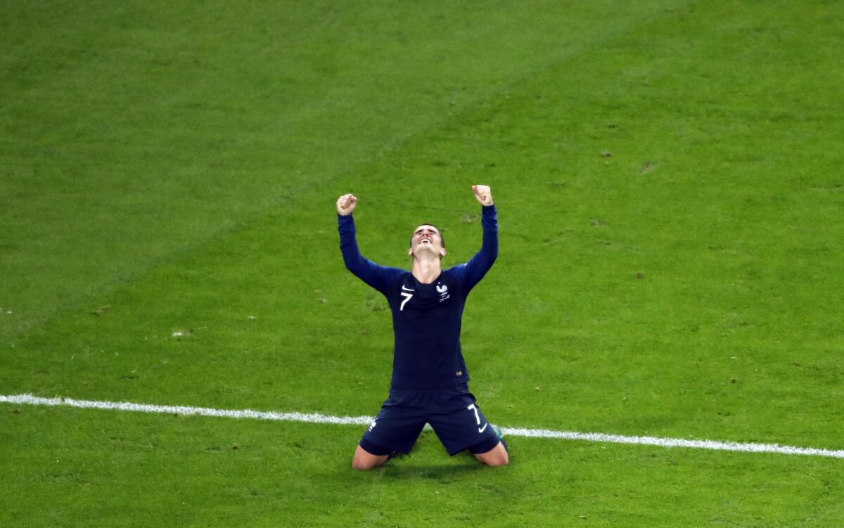 France's Antoine Griezmann celebrates at the end of the semifinal match between France and Belgium at the 2018 soccer World Cup in the St. Petersburg Stadium in St. Petersburg, Russia, Tuesday, July 10, 2018.