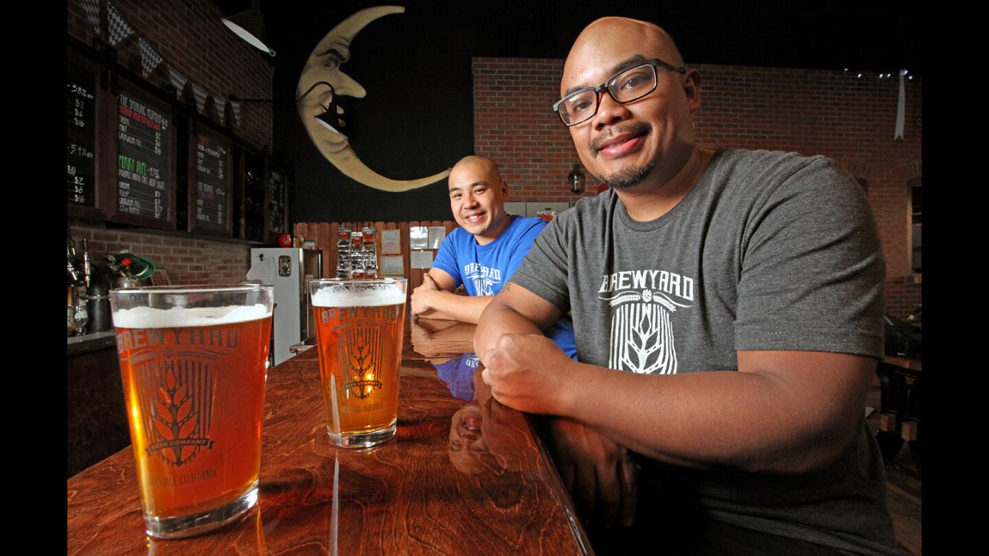 Brewyard co-owners Sherwin Antonio and Kirk Nishikawa with two of the beers currently available at the Brewyard, an Oktoberfest Rye Ale'd Lager and the Imposter Syndrome, an India Pale Ale'd Lager. Photographed on Thursday, October 20, 2016.